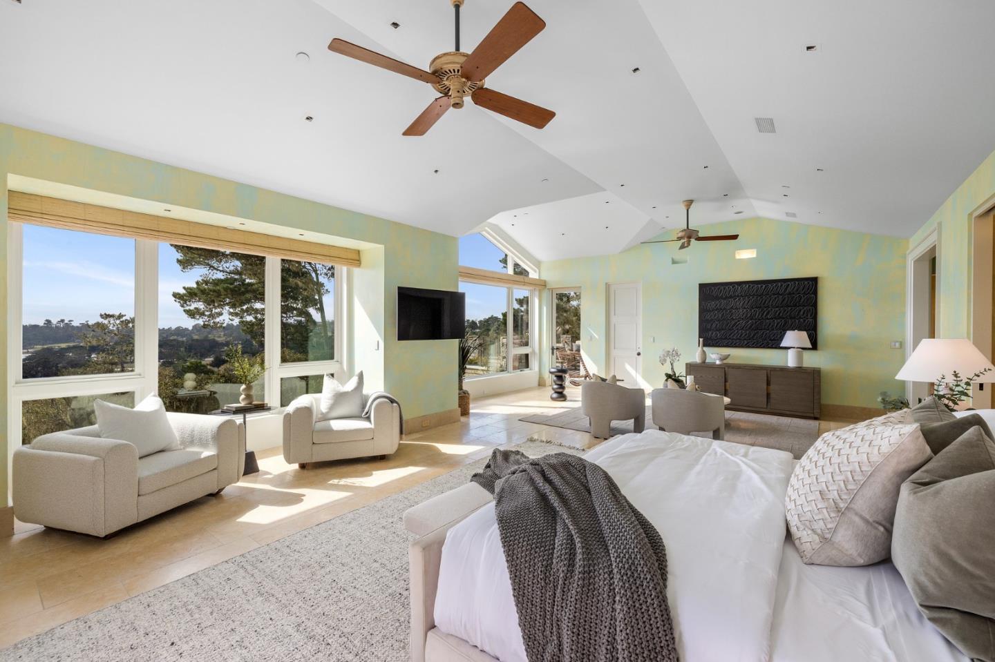 3204 Palmero Way Pebble Beach, CA 93953 - Photo 54 of 93 a large bedroom with a large bed and a flat screen tv