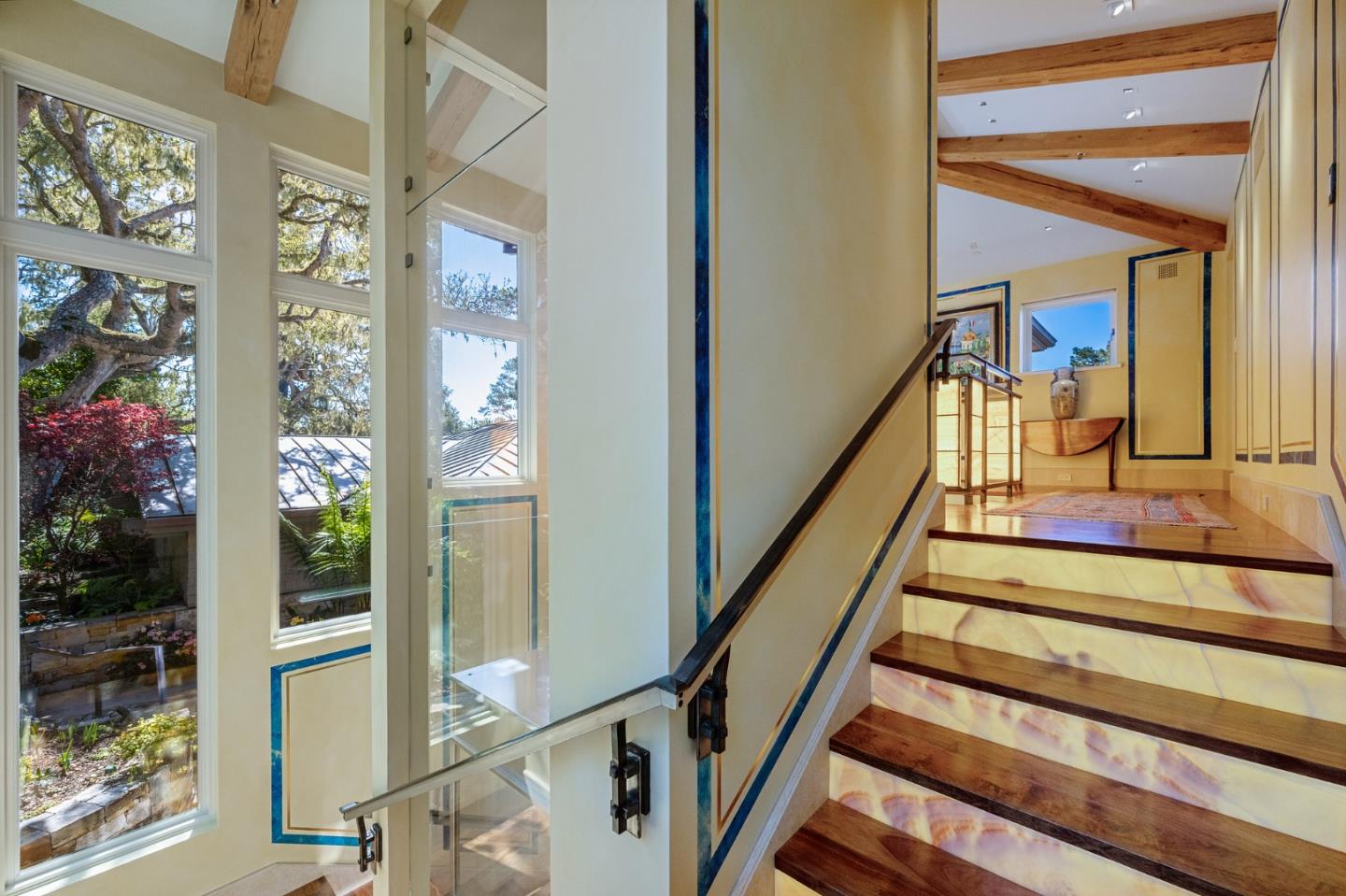 3204 Palmero Way Pebble Beach, CA 93953 - Photo 62 of 93 a view of staircase with wooden floor and a potted plant