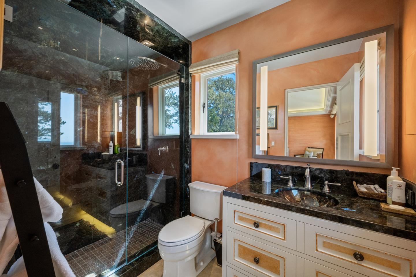 3204 Palmero Way Pebble Beach, CA 93953 - Photo 69 of 93 a bathroom with a granite countertop sink mirror vanity and toilet