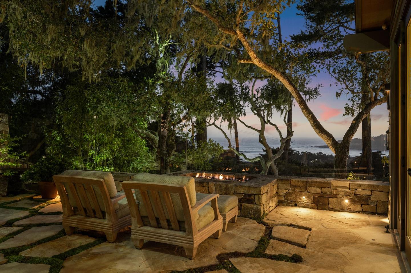 3204 Palmero Way Pebble Beach, CA 93953 - Photo 92 of 93 a view of a patio with table and chairs with wooden floor and fence