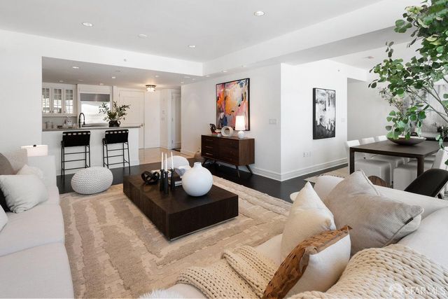 a living room with furniture and a table