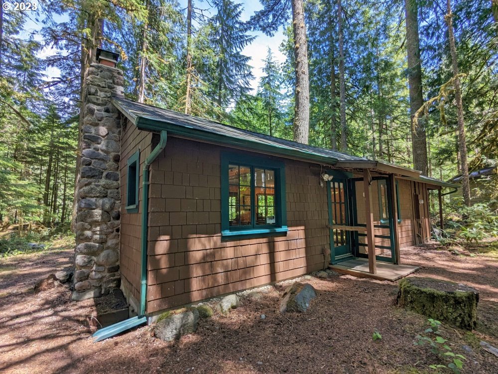 28084 Road 20 D Rhododendron, OR 97049 - Photo 1 of 32 a front view of a house with garden