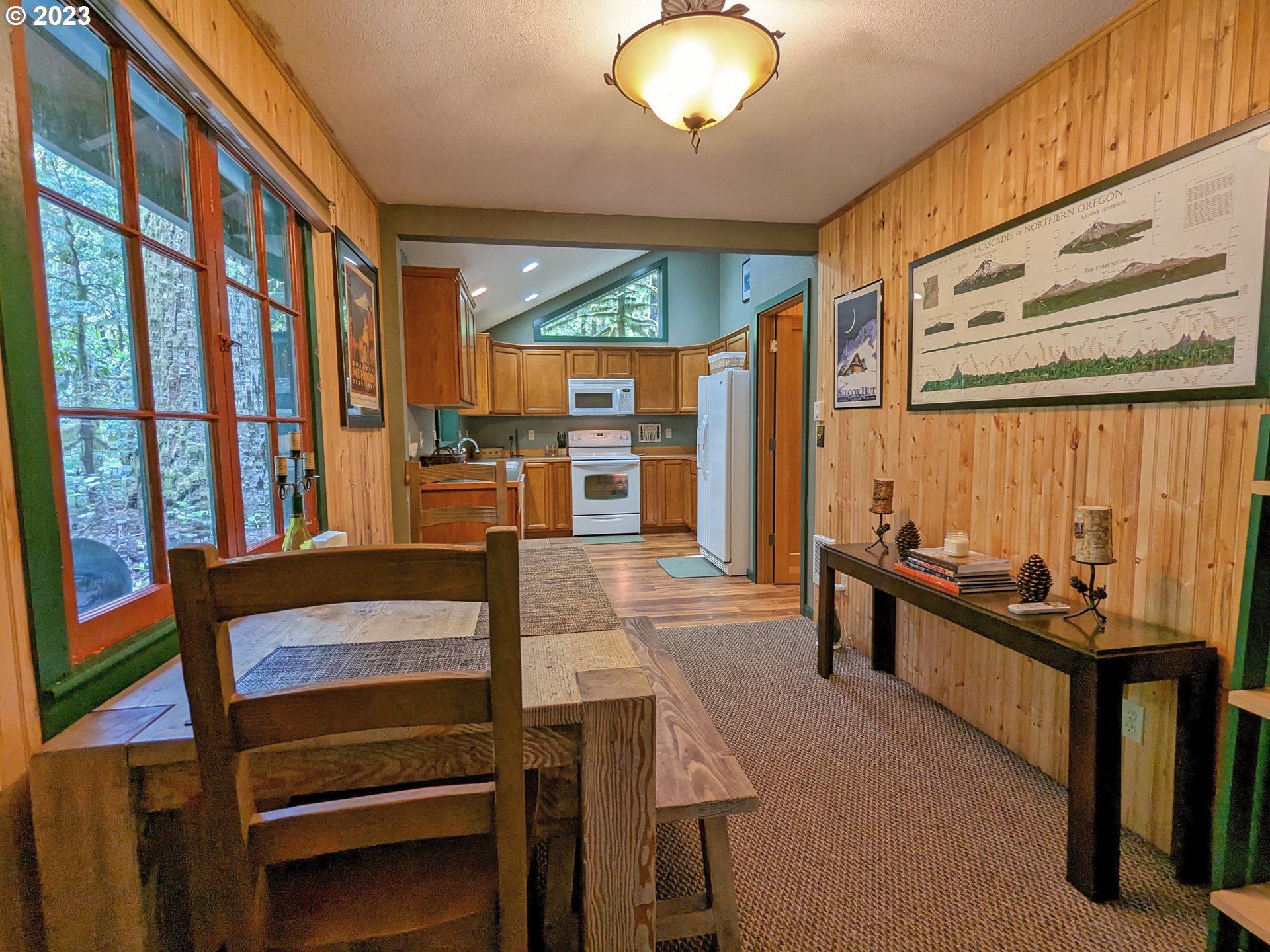 28084 Road 20 D Rhododendron, OR 97049 - Photo 14 of 32 a view of a dining room with furniture window and wooden floor