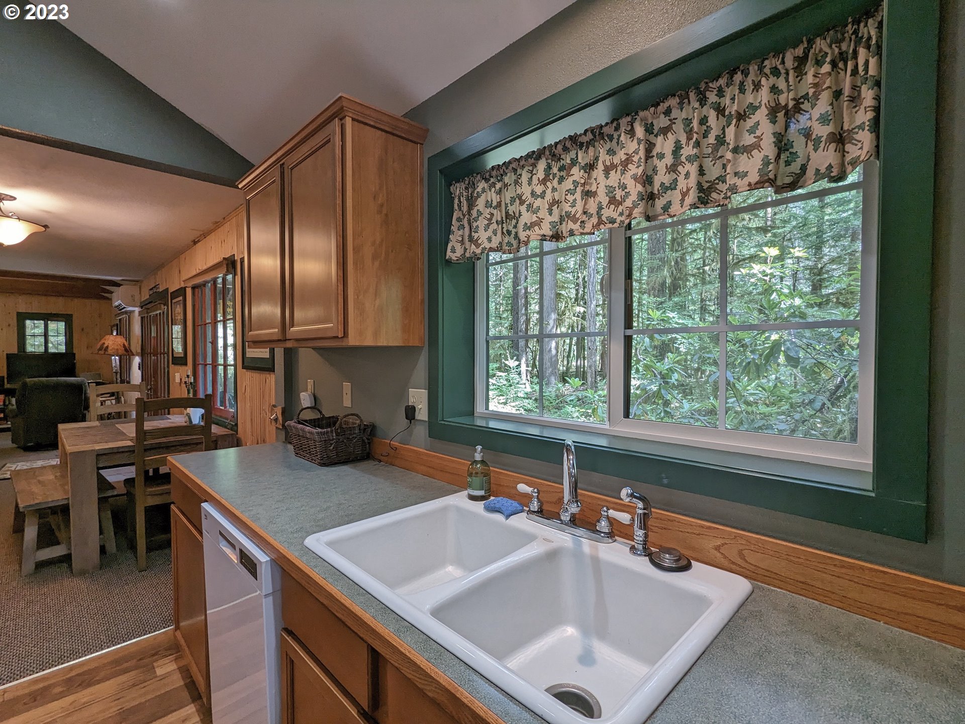 28084 Road 20 D Rhododendron, OR 97049 - Photo 19 of 32 a kitchen with a sink a stove and chairs