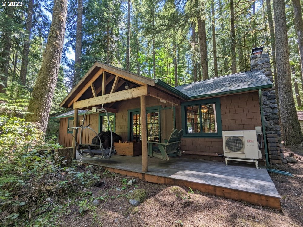 28084 Road 20 D Rhododendron, OR 97049 - Photo 2 of 32 a front view of a house with garden
