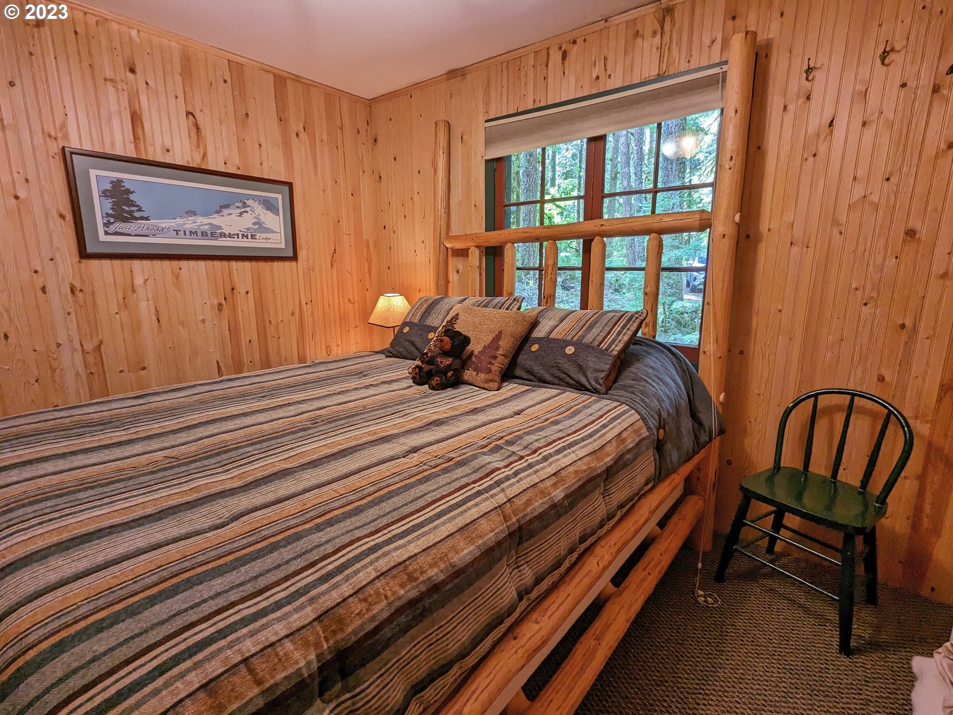 28084 Road 20 D Rhododendron, OR 97049 - Photo 24 of 32 a bedroom with a bed and a window