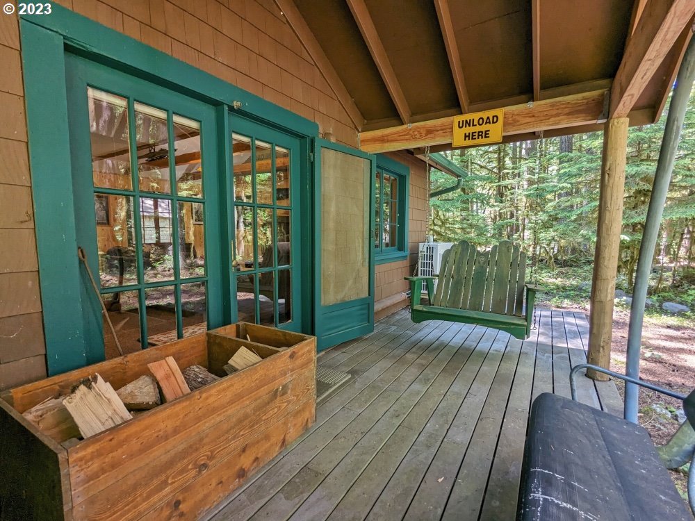 28084 Road 20 D Rhododendron, OR 97049 - Photo 28 of 32 a balcony with furniture and wooden floor