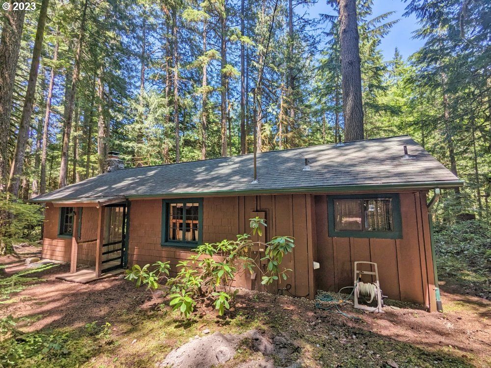 28084 Road 20 D Rhododendron, OR 97049 - Photo 3 of 32 a front view of a house with garden