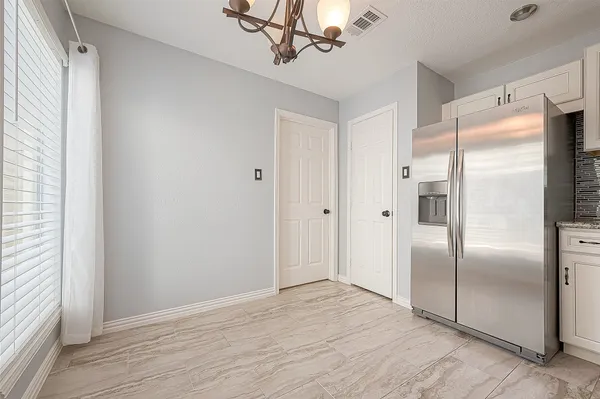 a view of a kitchen with a stove cabinets and wooden floor