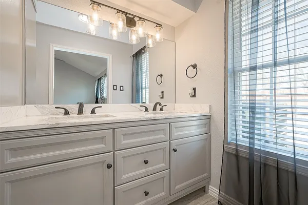 a white bath tub sitting next to a white toilet