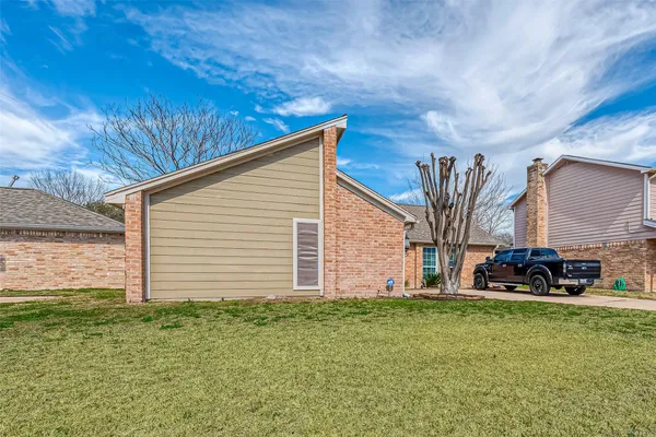 a backyard of a house with lots of green space