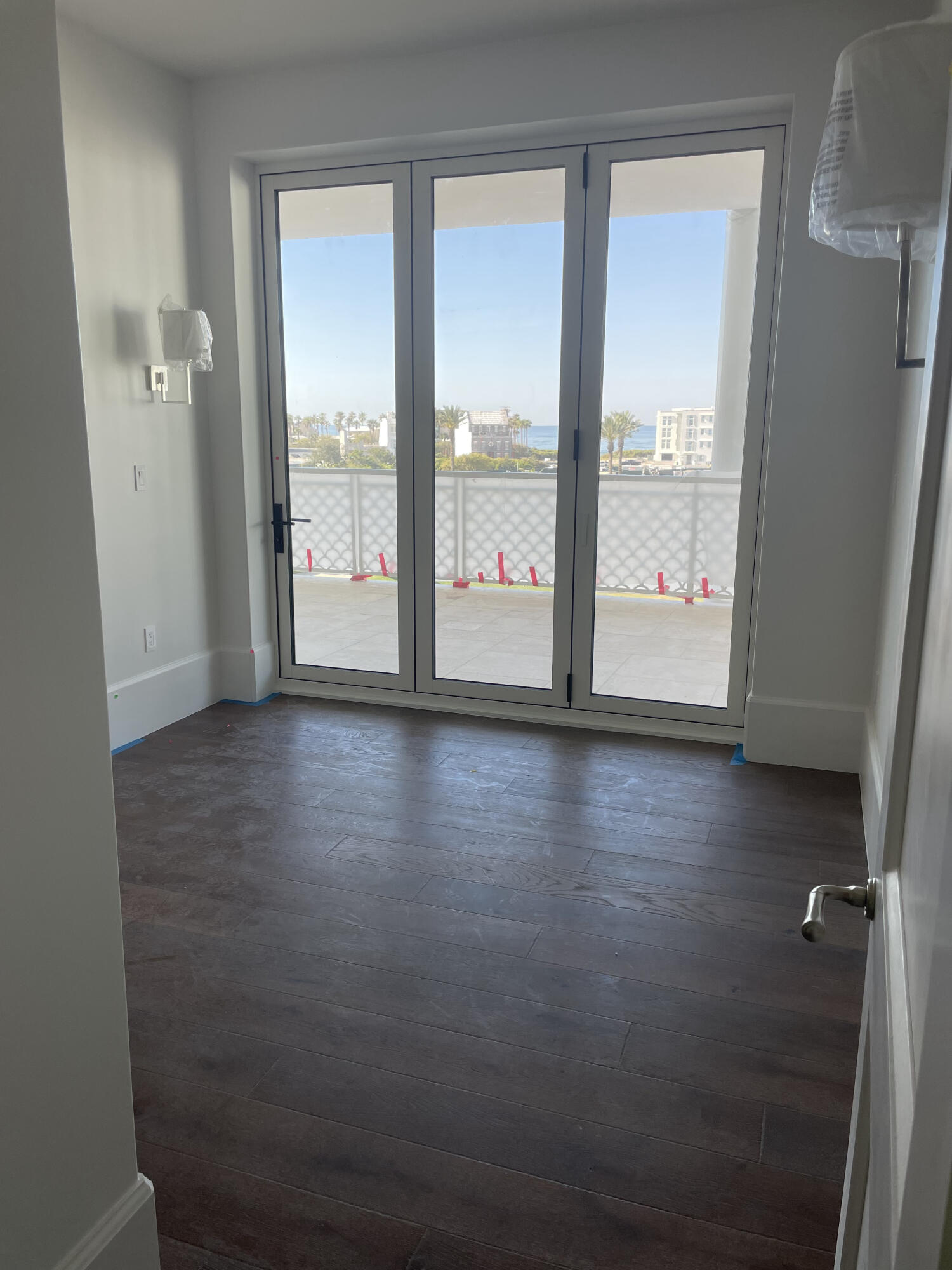 Tbd Tbd Admirality Row, Unit 303 Inlet Beach, FL 32461 - Photo 25 of 39 a view of an empty room with wooden floor and a window