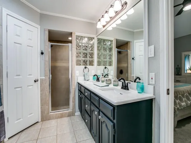 a bathroom with a sink vanity and a mirror