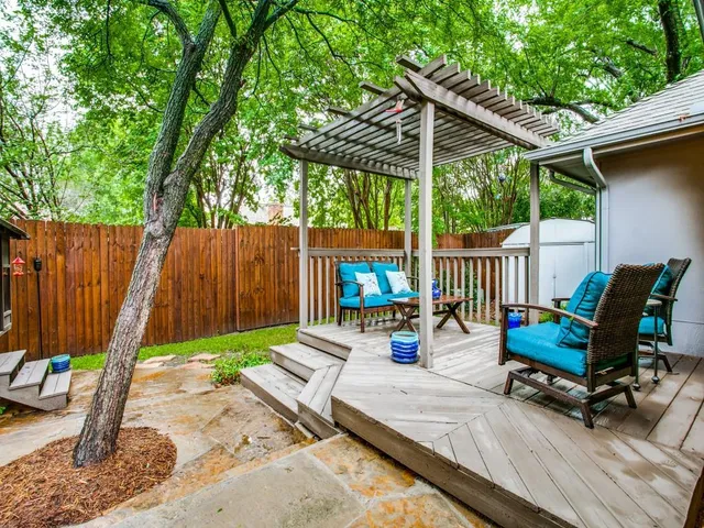 a wooden bench sitting in the middle of a park