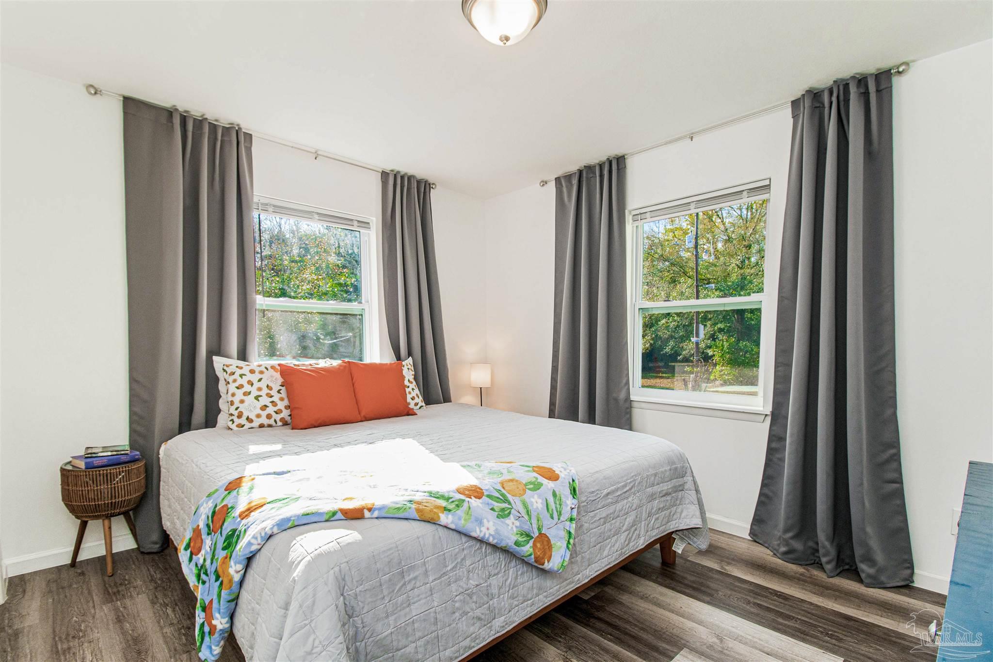 100 Mango Street Pensacola, FL 32503 - Photo 11 of 47 a bedroom with a bed and a window