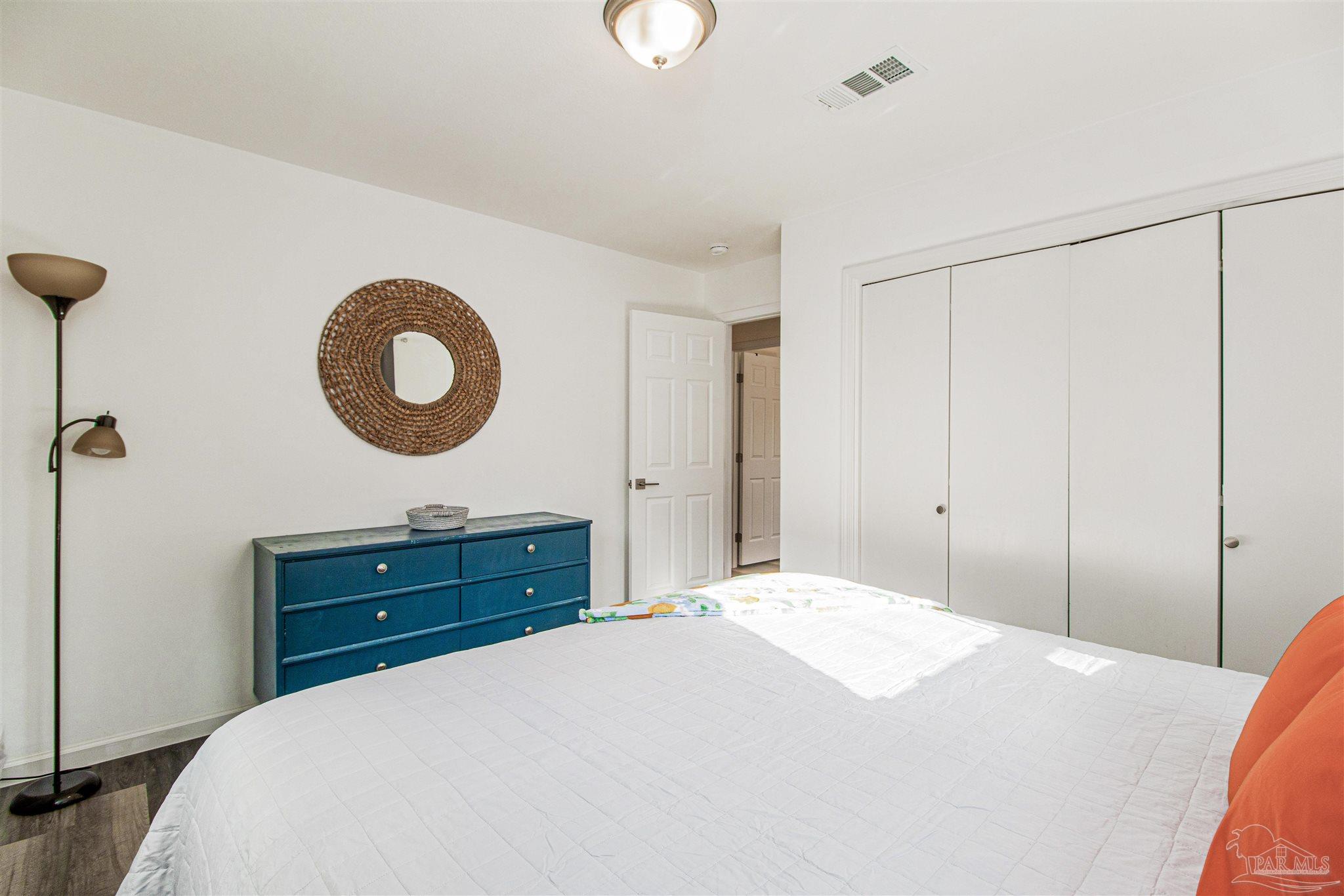 100 Mango Street Pensacola, FL 32503 - Photo 12 of 47 a bedroom with a bed and cabinets