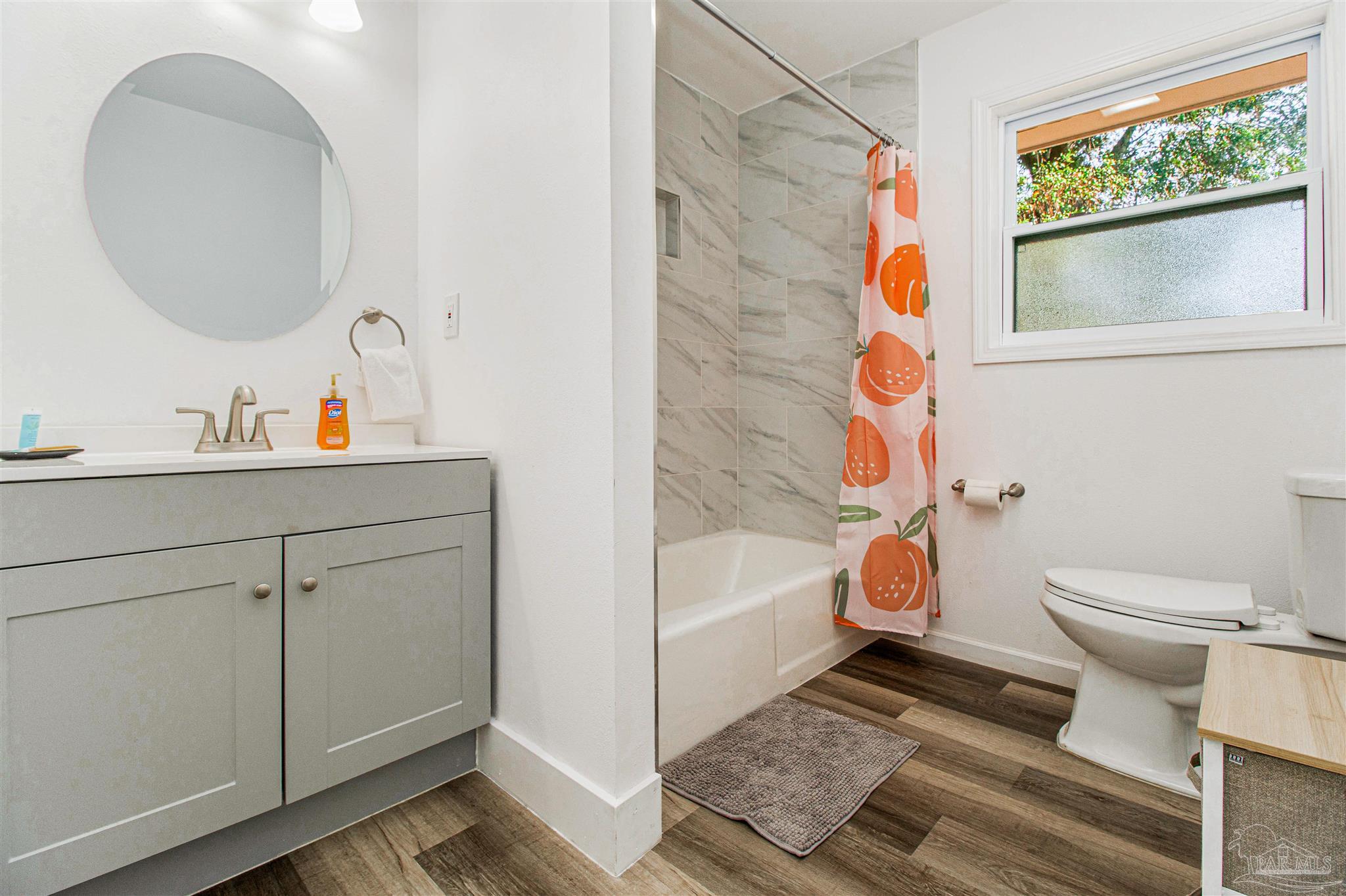 100 Mango Street Pensacola, FL 32503 - Photo 15 of 47 a bathroom with a sink toilet and shower