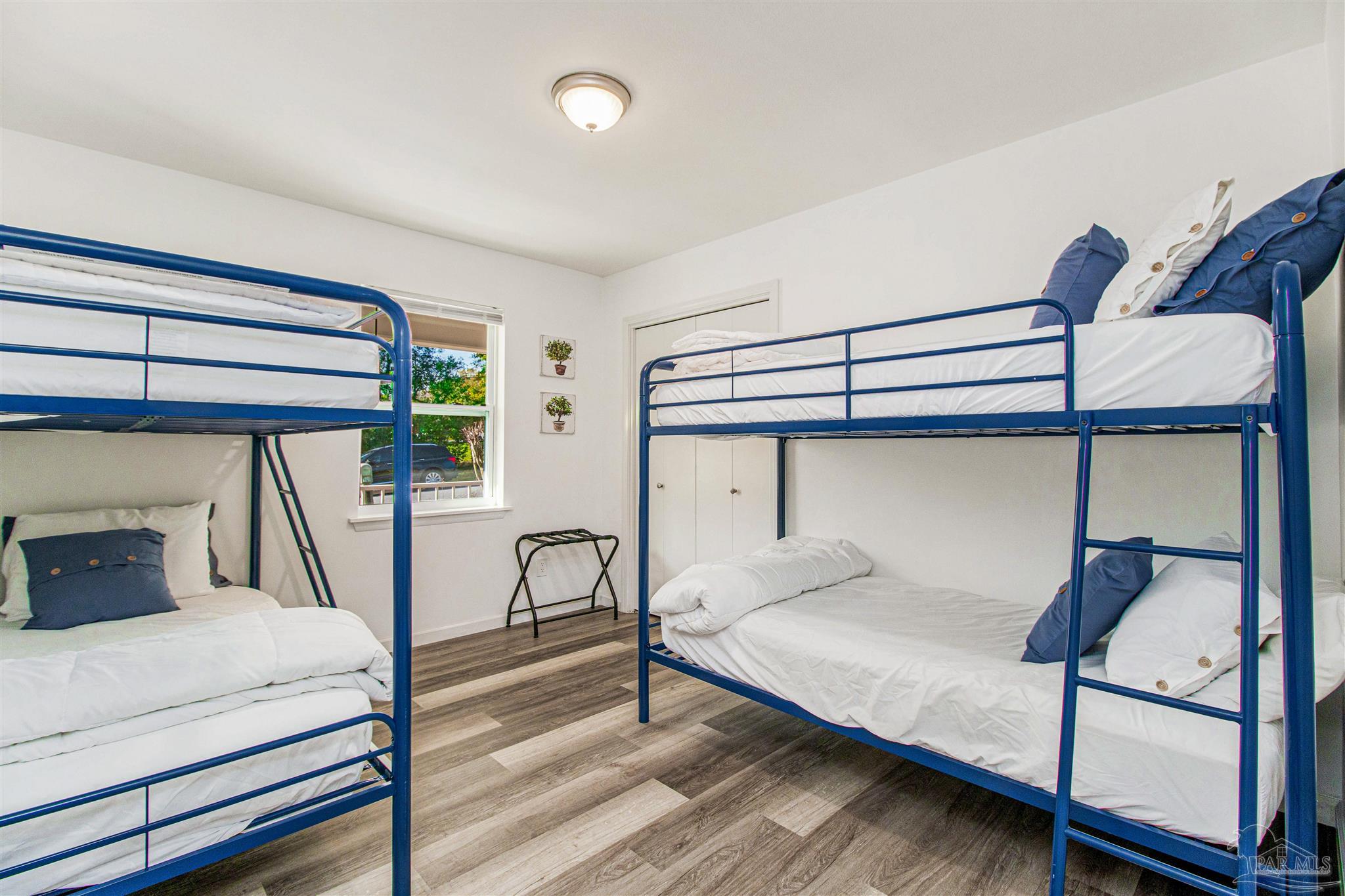 100 Mango Street Pensacola, FL 32503 - Photo 17 of 47 a bedroom with a bed and a window