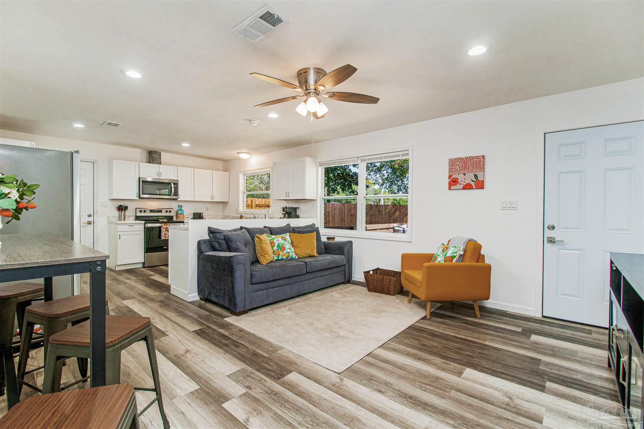 100 Mango Street Pensacola, FL 32503 - Photo 24 of 47 a living room with furniture and kitchen view