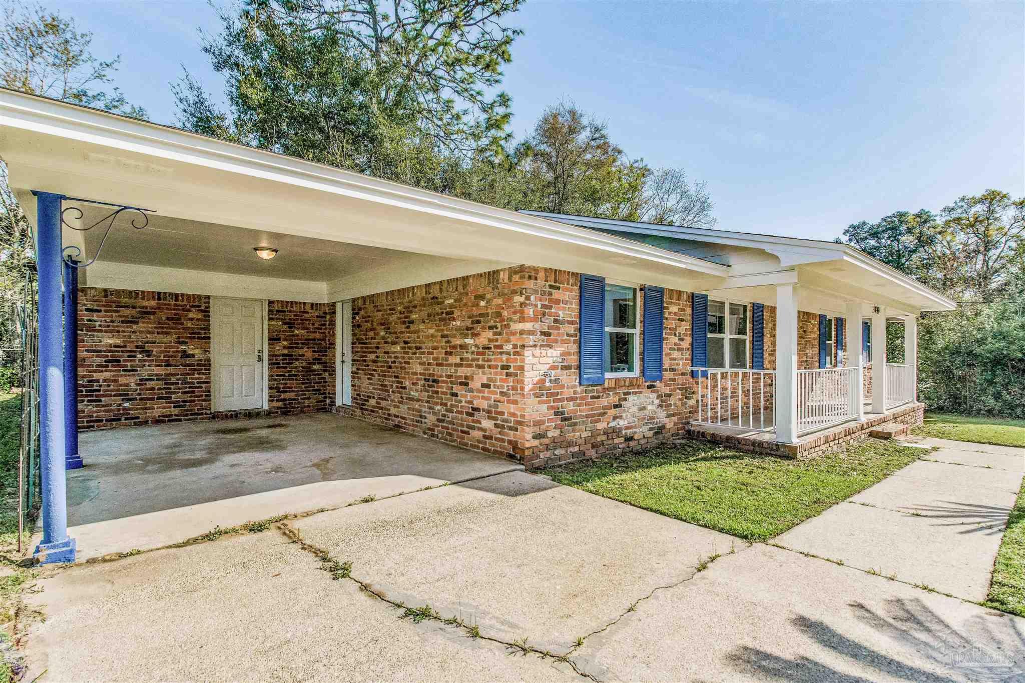 100 Mango Street Pensacola, FL 32503 - Photo 40 of 47 a view of a house with a garden