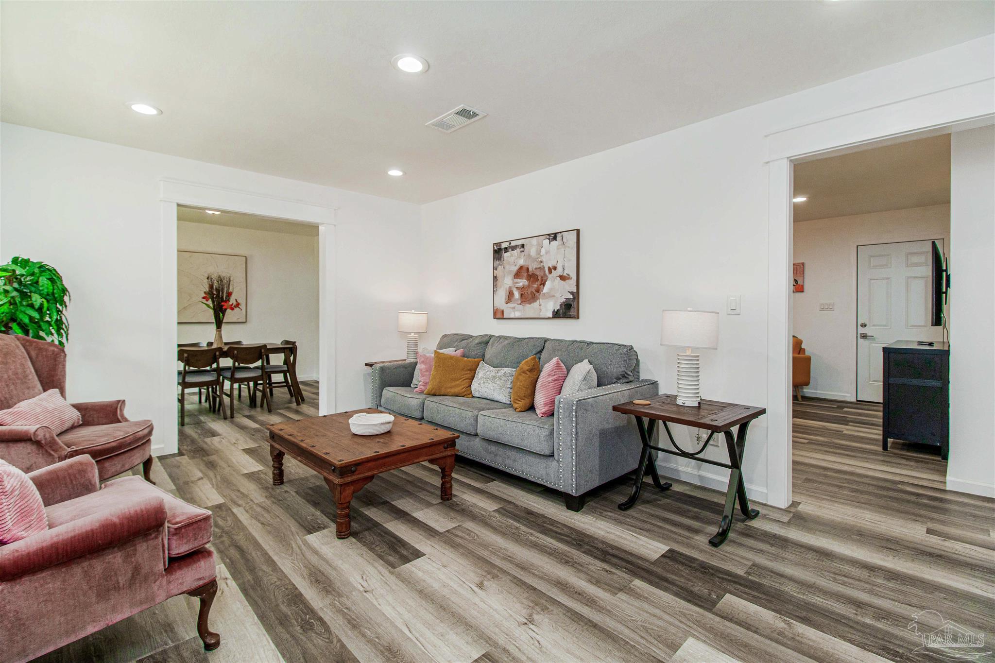 100 Mango Street Pensacola, FL 32503 - Photo 4 of 47 a living room with furniture and a wooden floor