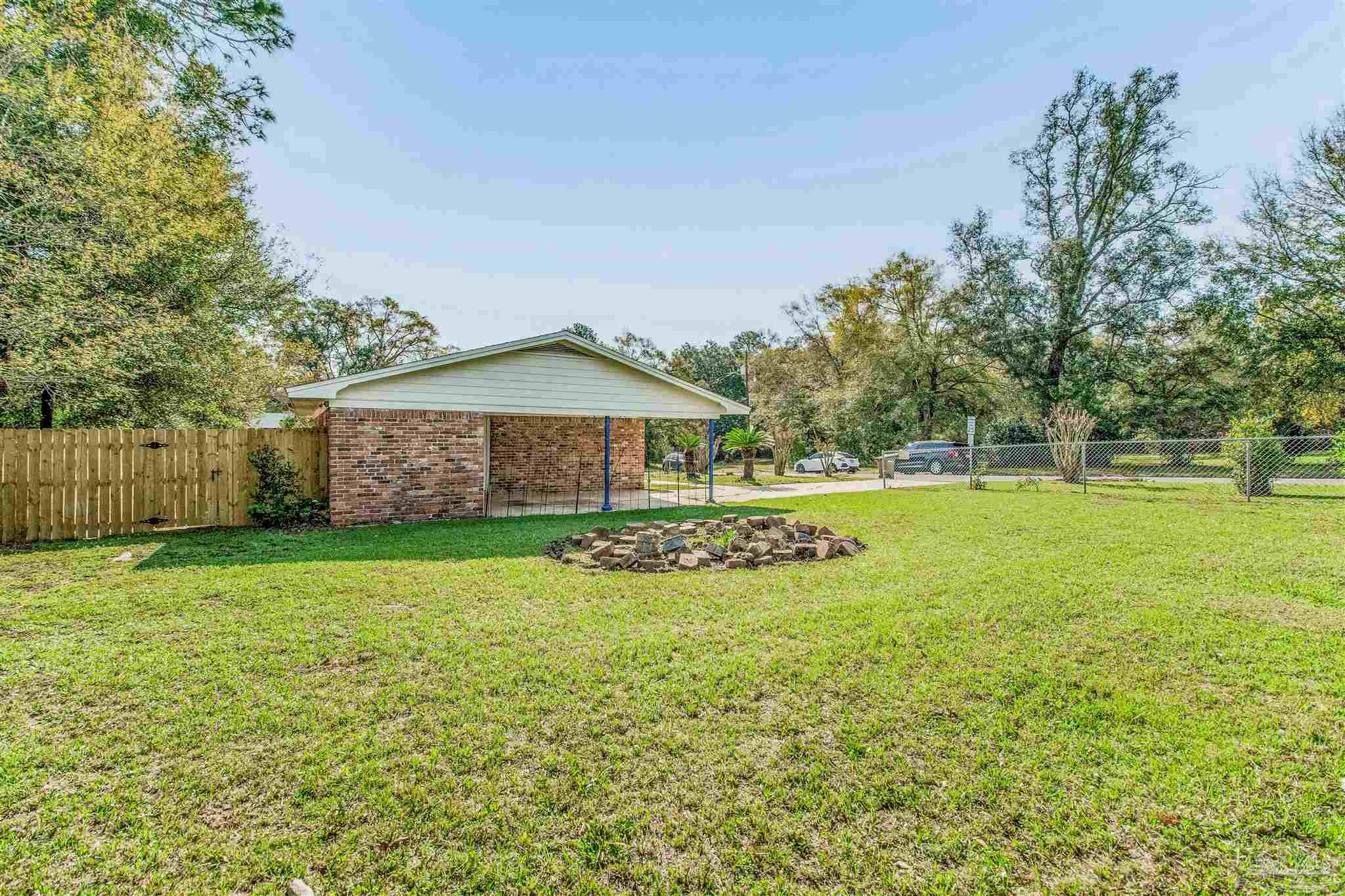 100 Mango Street Pensacola, FL 32503 - Photo 41 of 47 a view of a house with a big yard