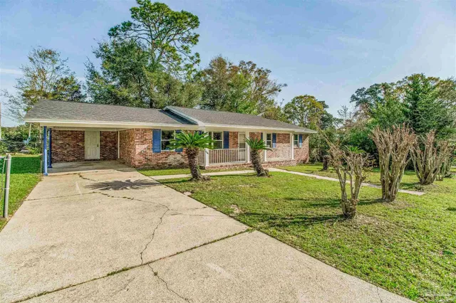 front view of a house with a yard
