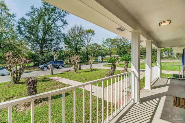 a view of a porch and garden