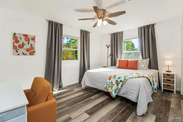 a bedroom with a bed and a chair