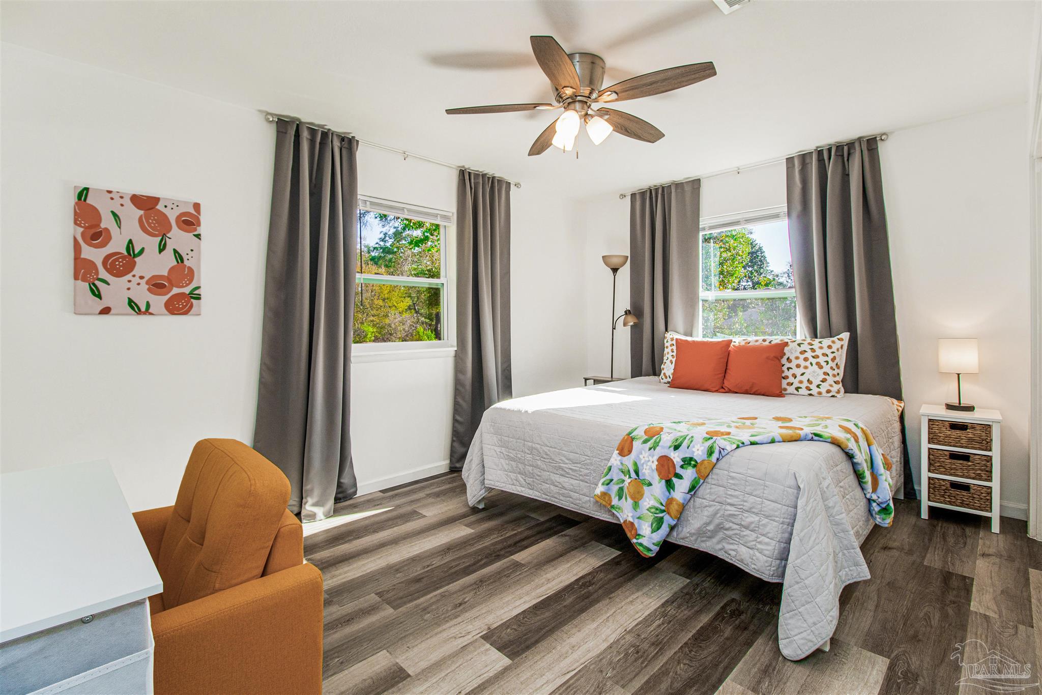 100 Mango Street Pensacola, FL 32503 - Photo 7 of 47 a bedroom with a bed and a chair