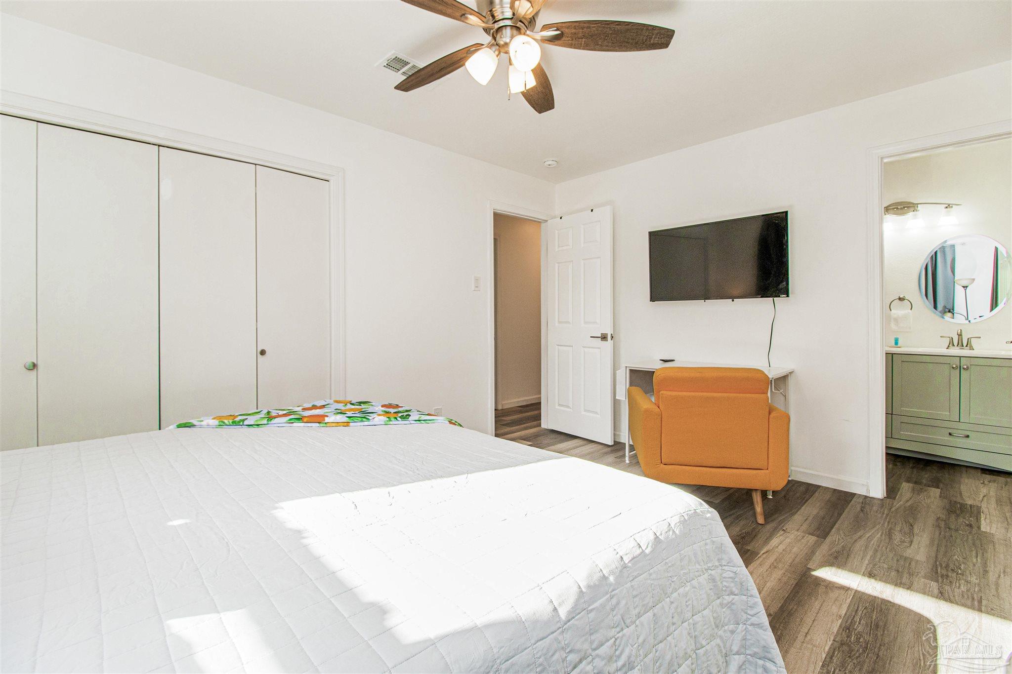 100 Mango Street Pensacola, FL 32503 - Photo 10 of 47 a bedroom with a bed and a flat screen tv