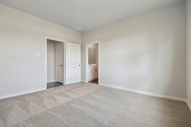 a view of an empty room and entryway
