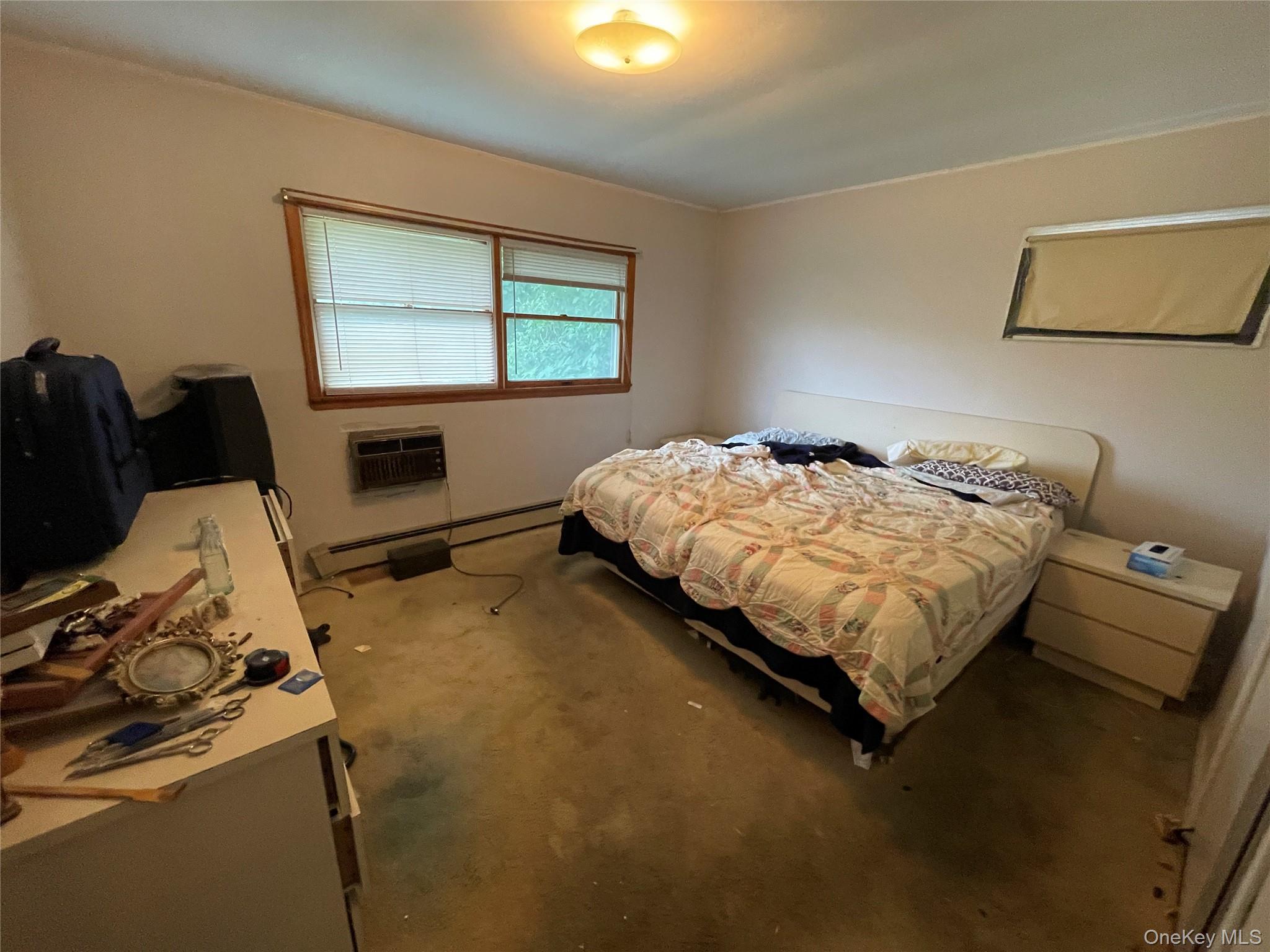 2043 Paddock Road Seaford, NY 11783 - Photo 12 of 25 a bedroom with a bed and window