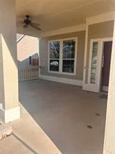 a view of an empty room and a window