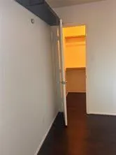 a view of an empty room and a window