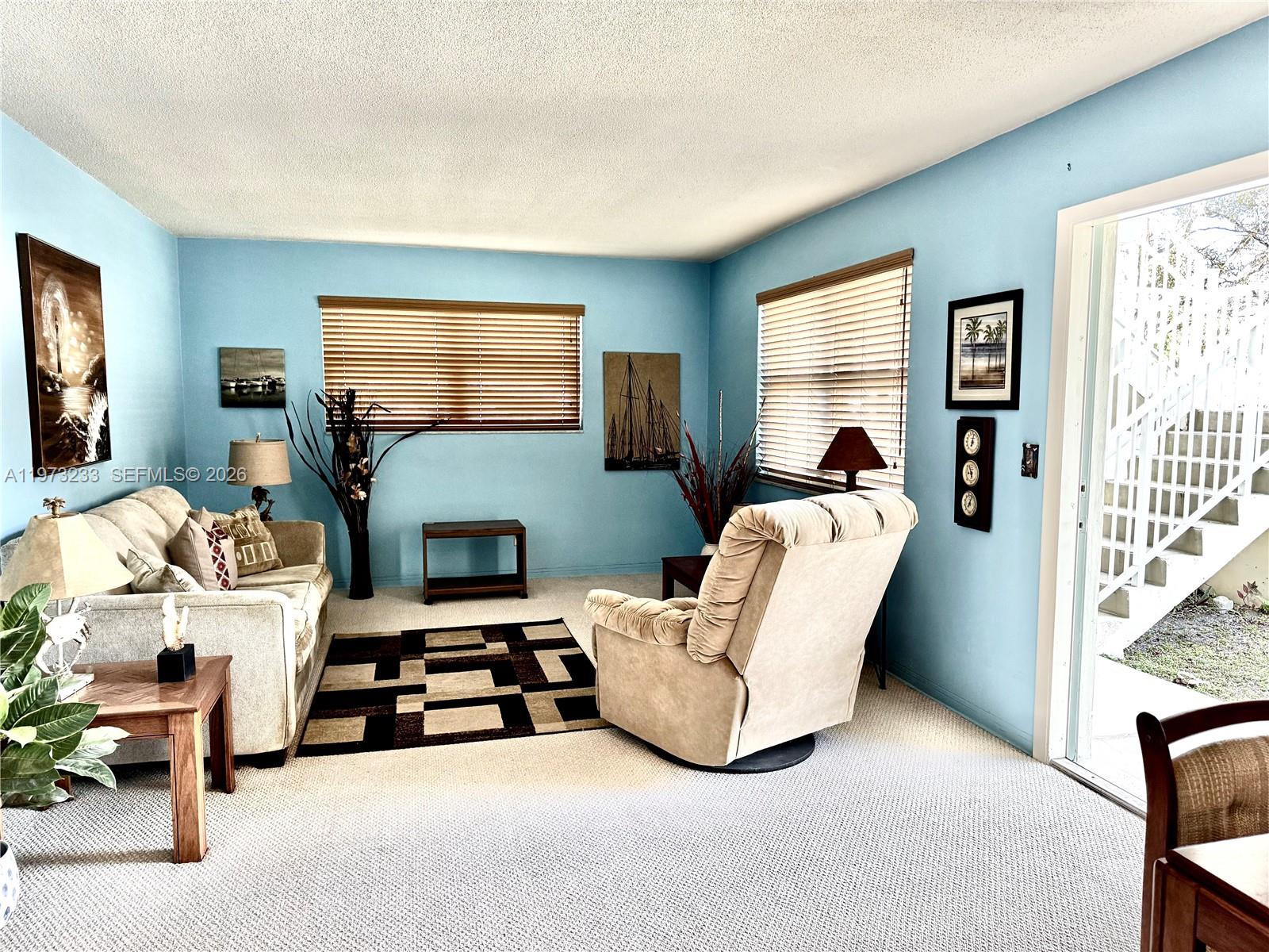 3500 Harrison Street, Unit 7 Hollywood, FL 33021 - Photo 12 of 66 a living room with furniture and a fireplace