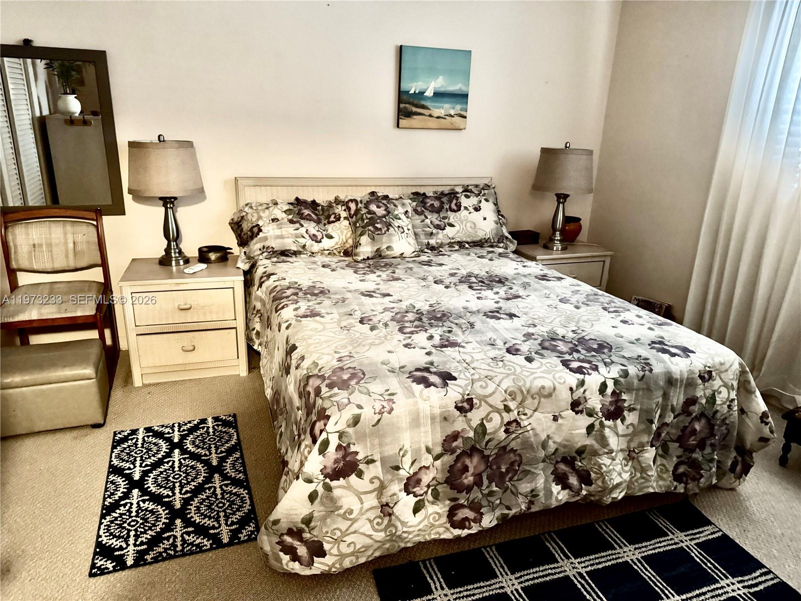 3500 Harrison Street, Unit 7 Hollywood, FL 33021 - Photo 16 of 66 a bedroom with a bed and a flat tv screen on the dresser