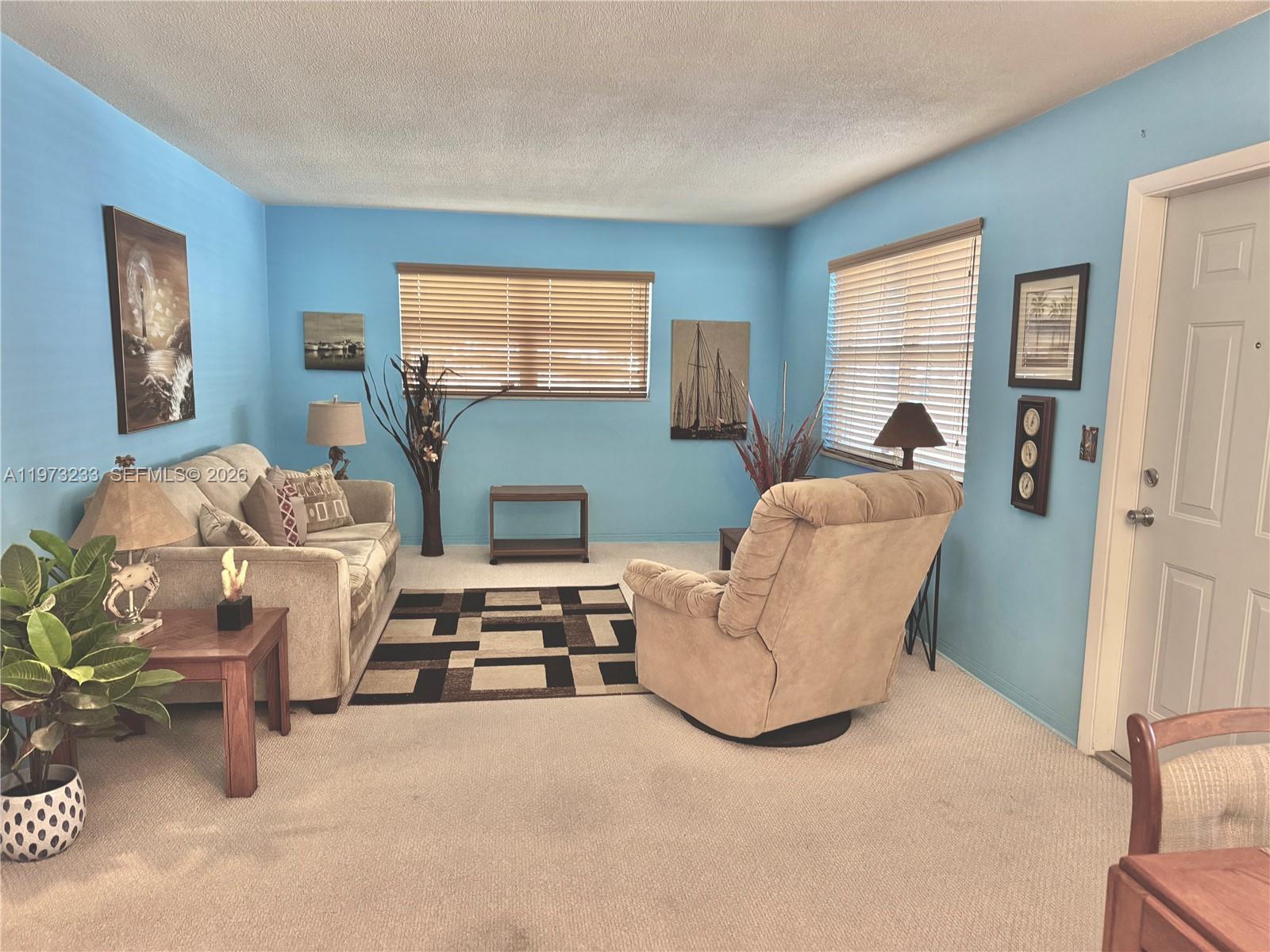 3500 Harrison Street, Unit 7 Hollywood, FL 33021 - Photo 33 of 66 a living room with furniture and a window