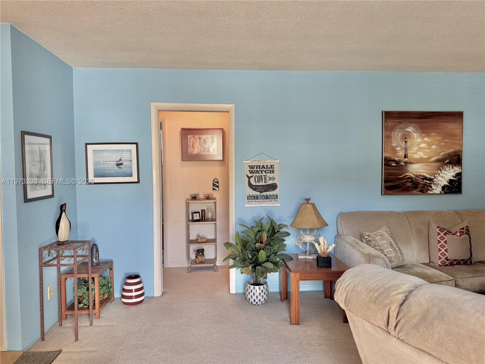 3500 Harrison Street, Unit 7 Hollywood, FL 33021 - Photo 34 of 66 a living room with furniture and a couch