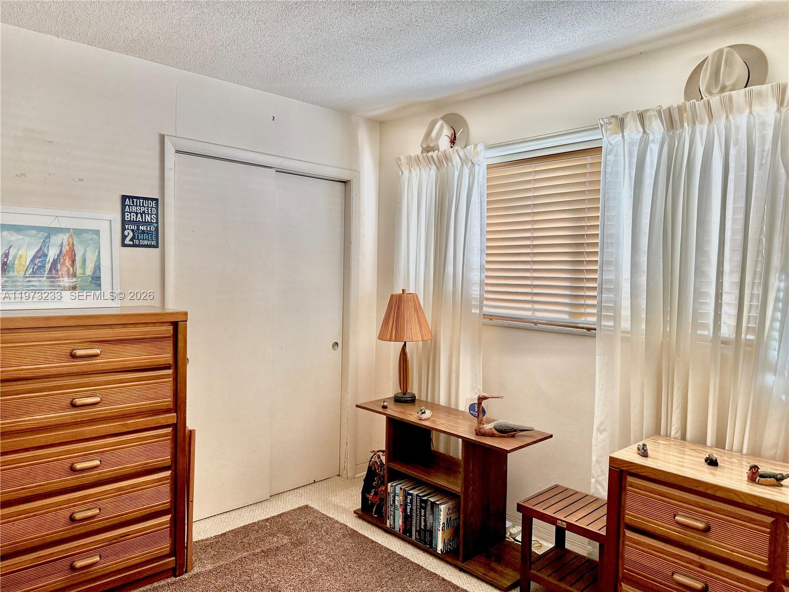 3500 Harrison Street, Unit 7 Hollywood, FL 33021 - Photo 38 of 66 a room with furniture and a window