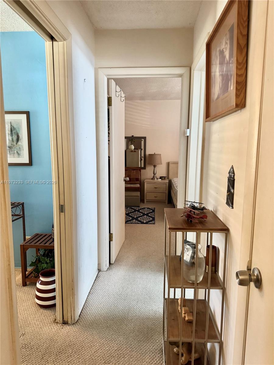 3500 Harrison Street, Unit 7 Hollywood, FL 33021 - Photo 41 of 66 a view of a hallway with furniture and front door