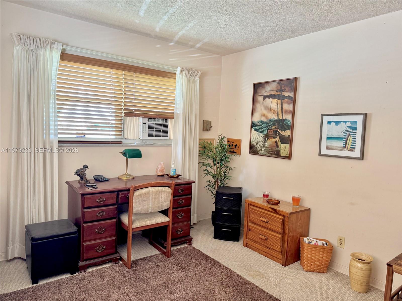 3500 Harrison Street, Unit 7 Hollywood, FL 33021 - Photo 43 of 66 a bedroom with a bed and a window