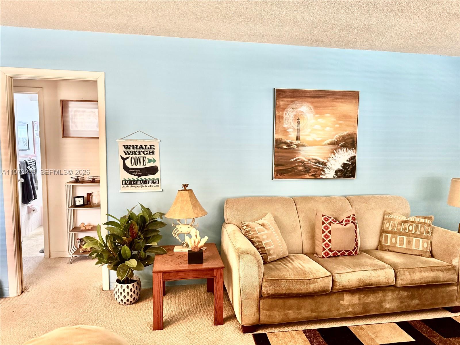 3500 Harrison Street, Unit 7 Hollywood, FL 33021 - Photo 44 of 66 a living room with furniture and a painting on the wall