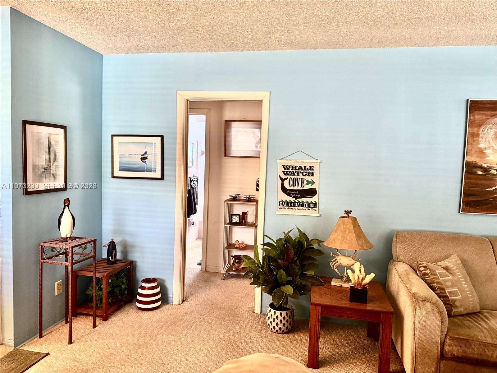 3500 Harrison Street, Unit 7 Hollywood, FL 33021 - Photo 45 of 66 a living room with furniture a couch and a window