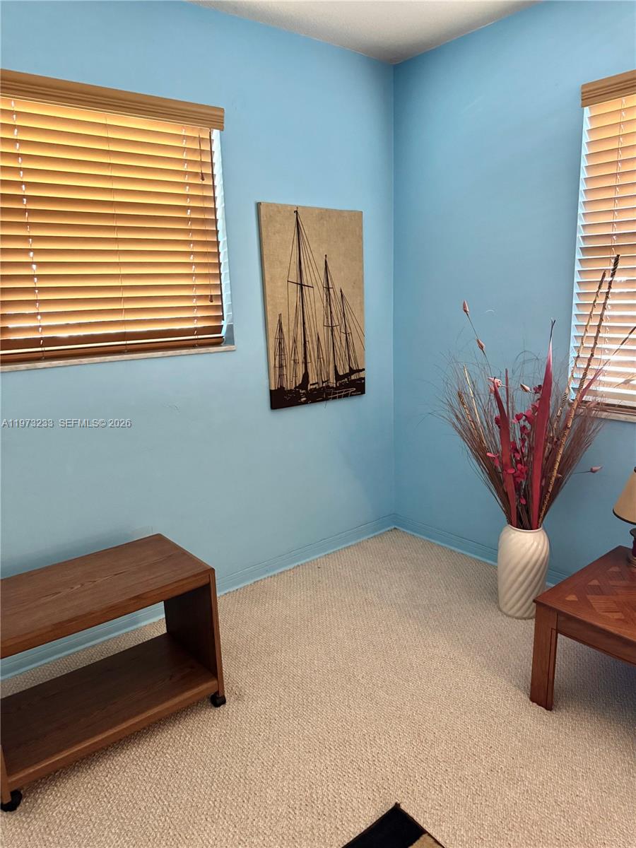 3500 Harrison Street, Unit 7 Hollywood, FL 33021 - Photo 47 of 66 a bedroom with a bed and a potted plant
