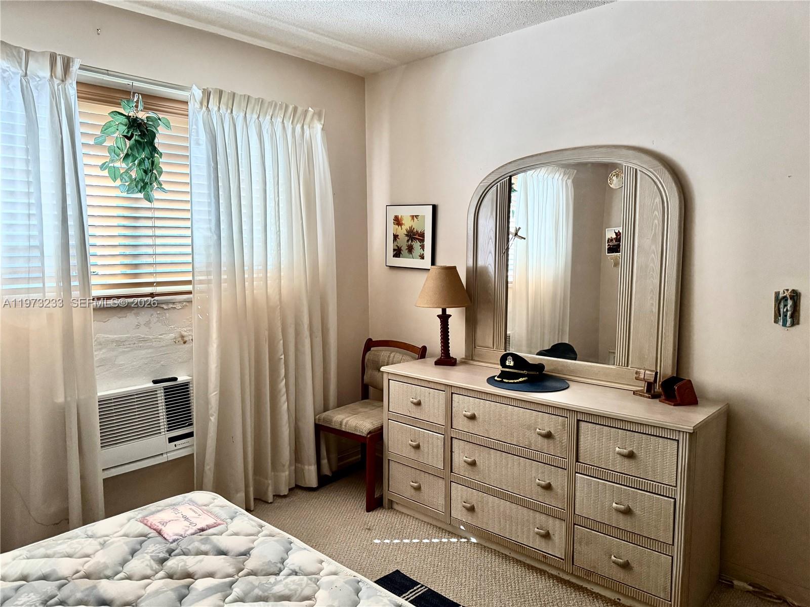 3500 Harrison Street, Unit 7 Hollywood, FL 33021 - Photo 56 of 66 a bathroom with a sink a toilet and a mirror