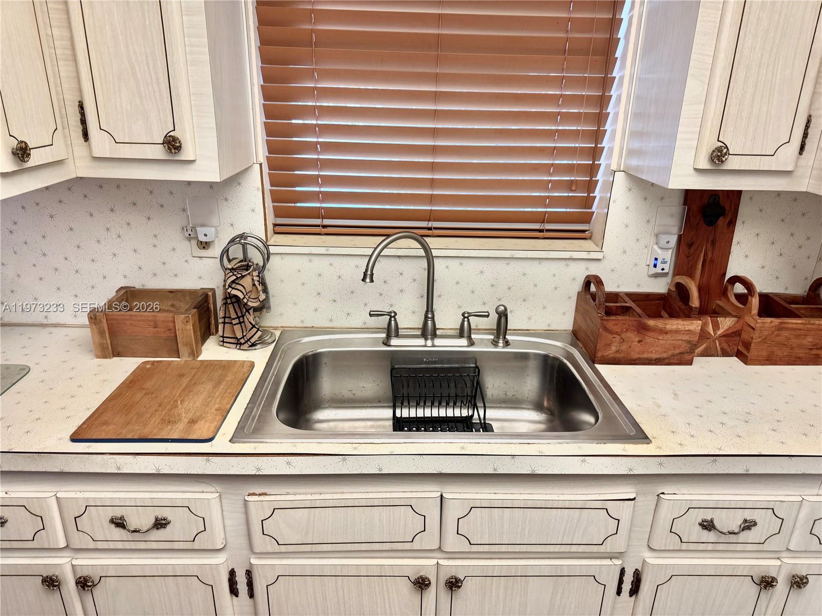 3500 Harrison Street, Unit 7 Hollywood, FL 33021 - Photo 6 of 66 a kitchen with a sink and cabinets