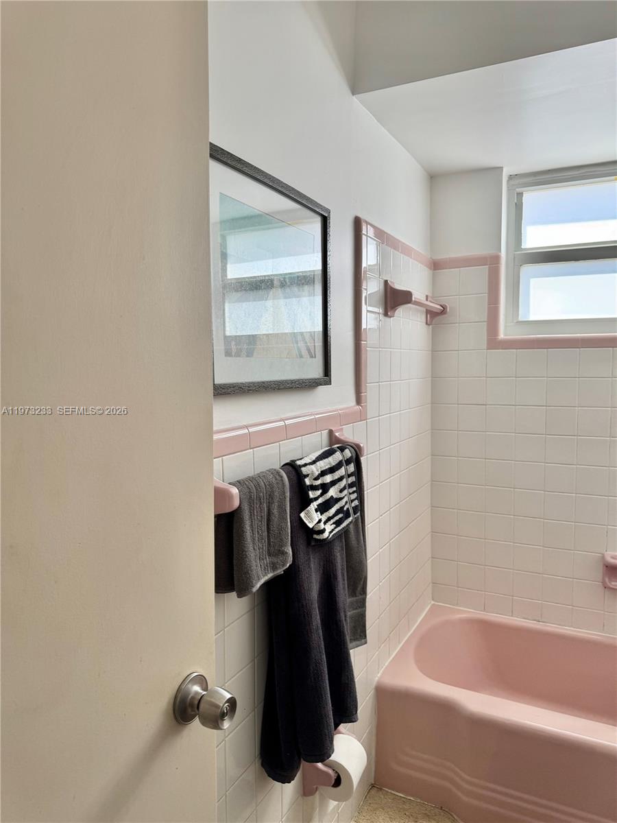 3500 Harrison Street, Unit 7 Hollywood, FL 33021 - Photo 61 of 66 a bathroom with a bathtub