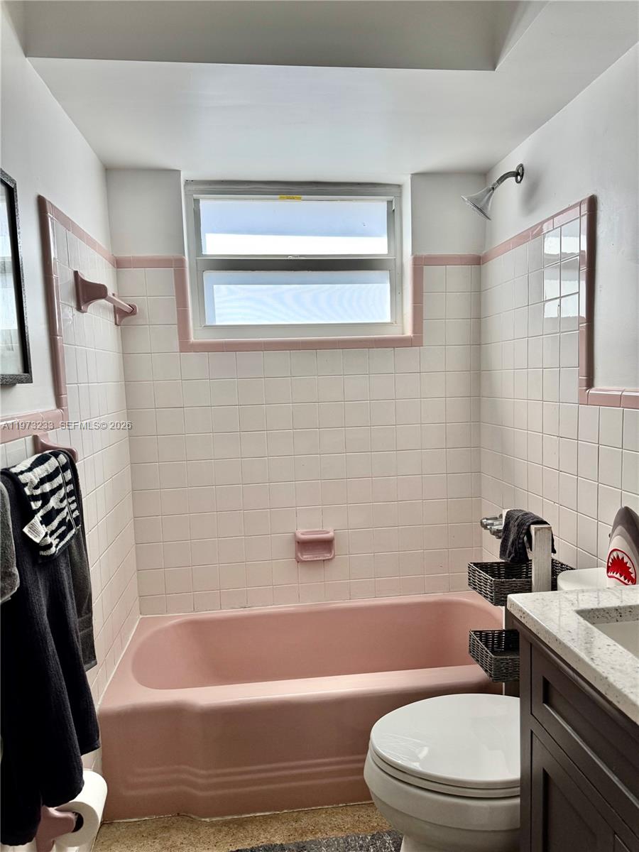 3500 Harrison Street, Unit 7 Hollywood, FL 33021 - Photo 62 of 66 a bathroom with a sink a toilet and a bathtub
