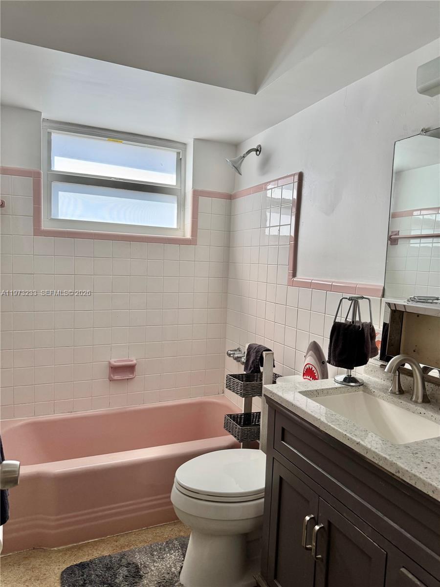 3500 Harrison Street, Unit 7 Hollywood, FL 33021 - Photo 64 of 66 a bathroom with a sink a toilet and bathtub
